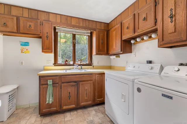 a kitchen with stainless steel appliances granite countertop a sink and cabinets
