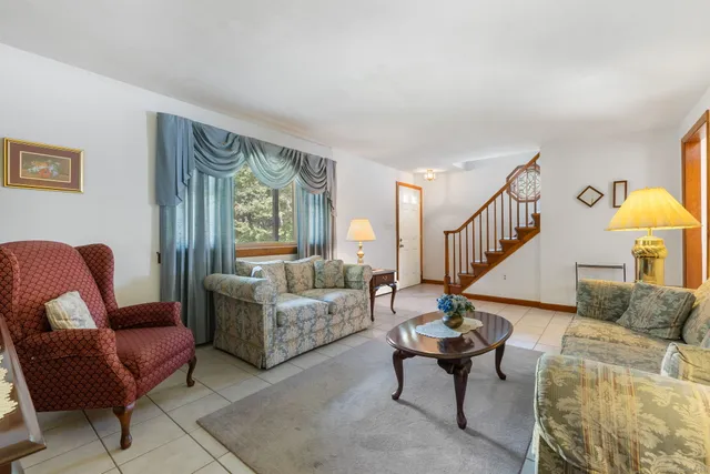 a living room with furniture and a table