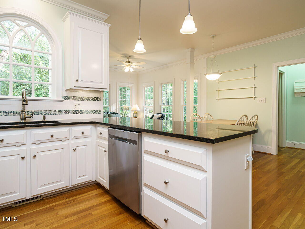 7201 Jonathan Drive Wendell, NC 27591 - Photo 15 of 43 a kitchen with a sink cabinets and window