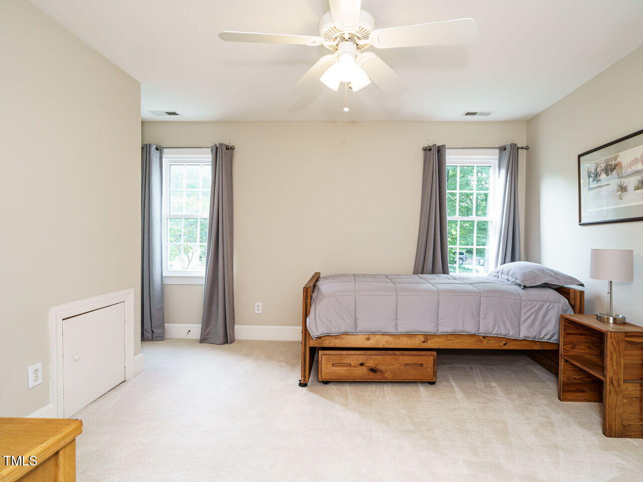 7201 Jonathan Drive Wendell, NC 27591 - Photo 27 of 43 a room with a bed and a chandelier