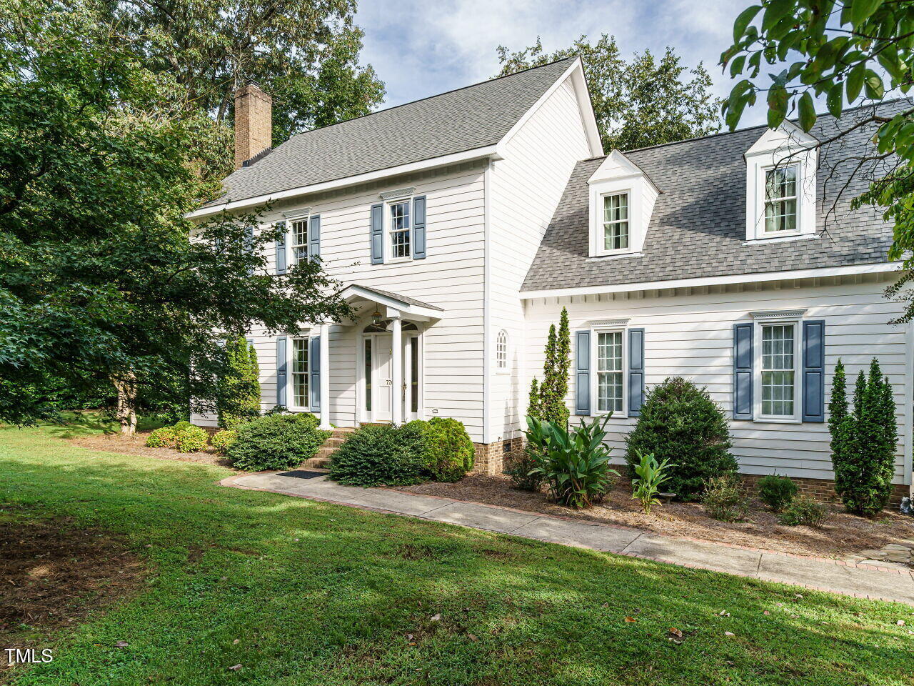 7201 Jonathan Drive Wendell, NC 27591 - Photo 2 of 43 a front view of a house with a yard and trees