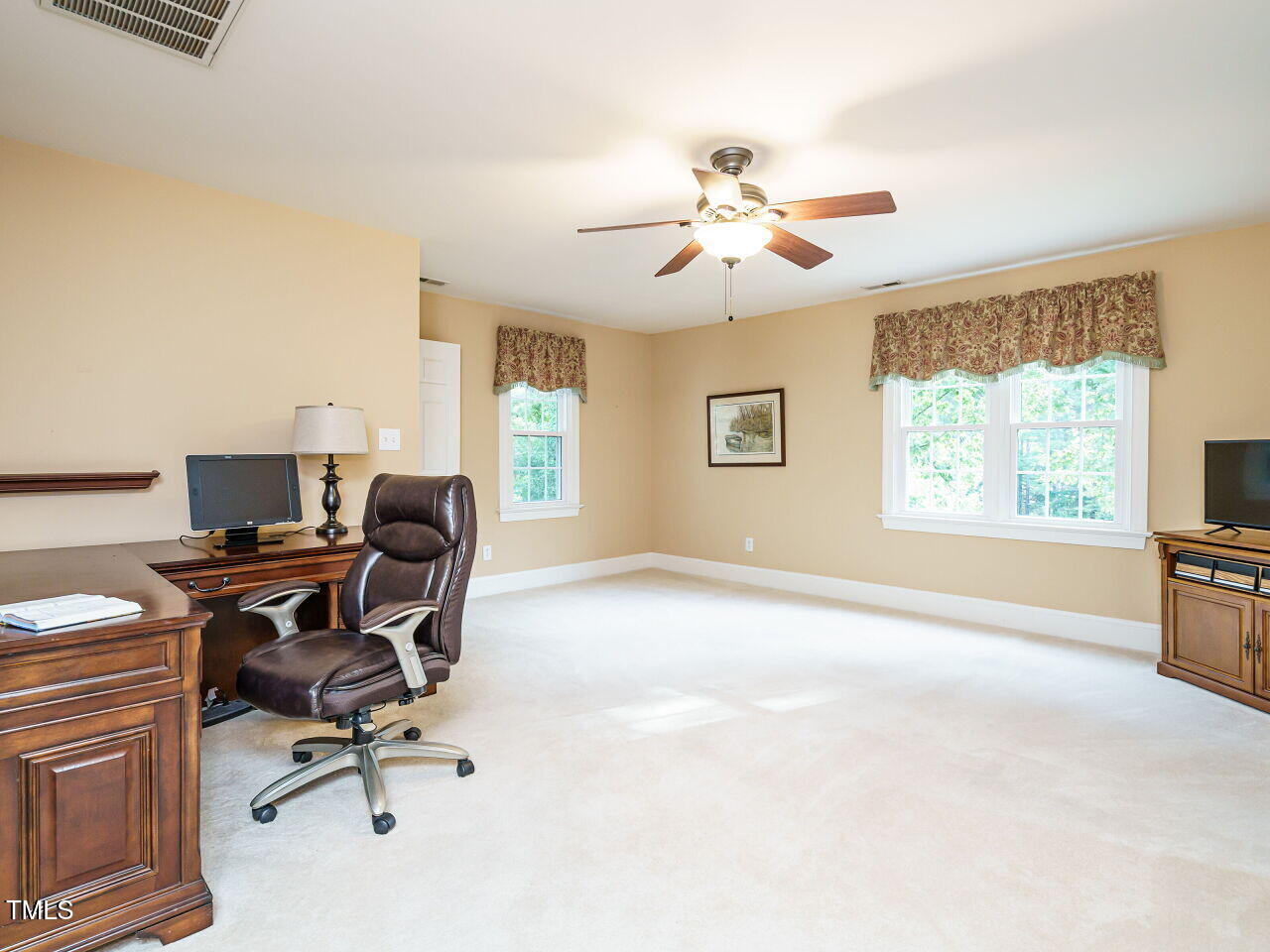 7201 Jonathan Drive Wendell, NC 27591 - Photo 30 of 43 a view of a workspace with furniture and a window