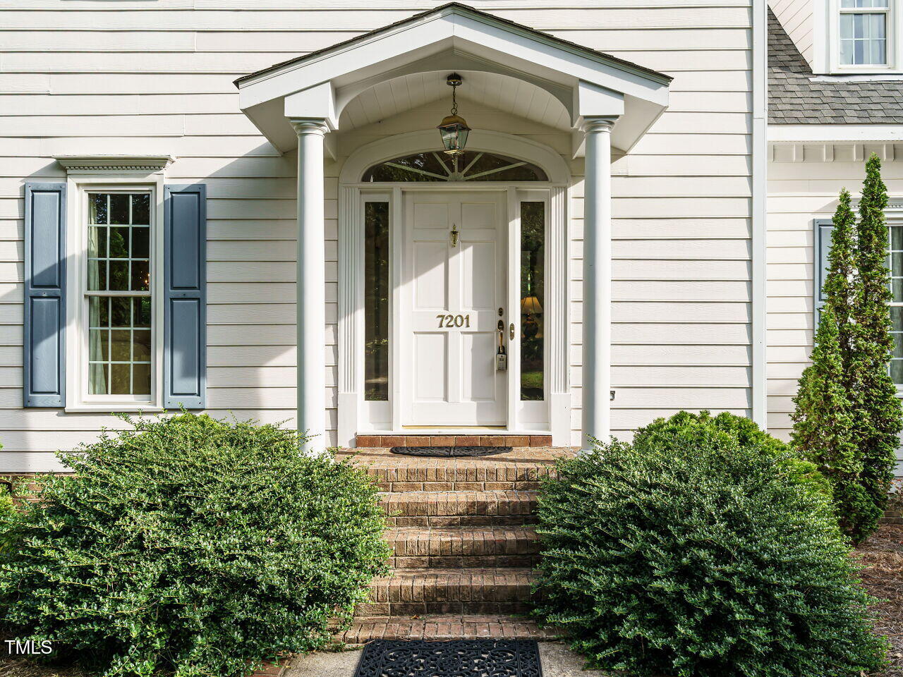 7201 Jonathan Drive Wendell, NC 27591 - Photo 3 of 43 a front view of a house with plants
