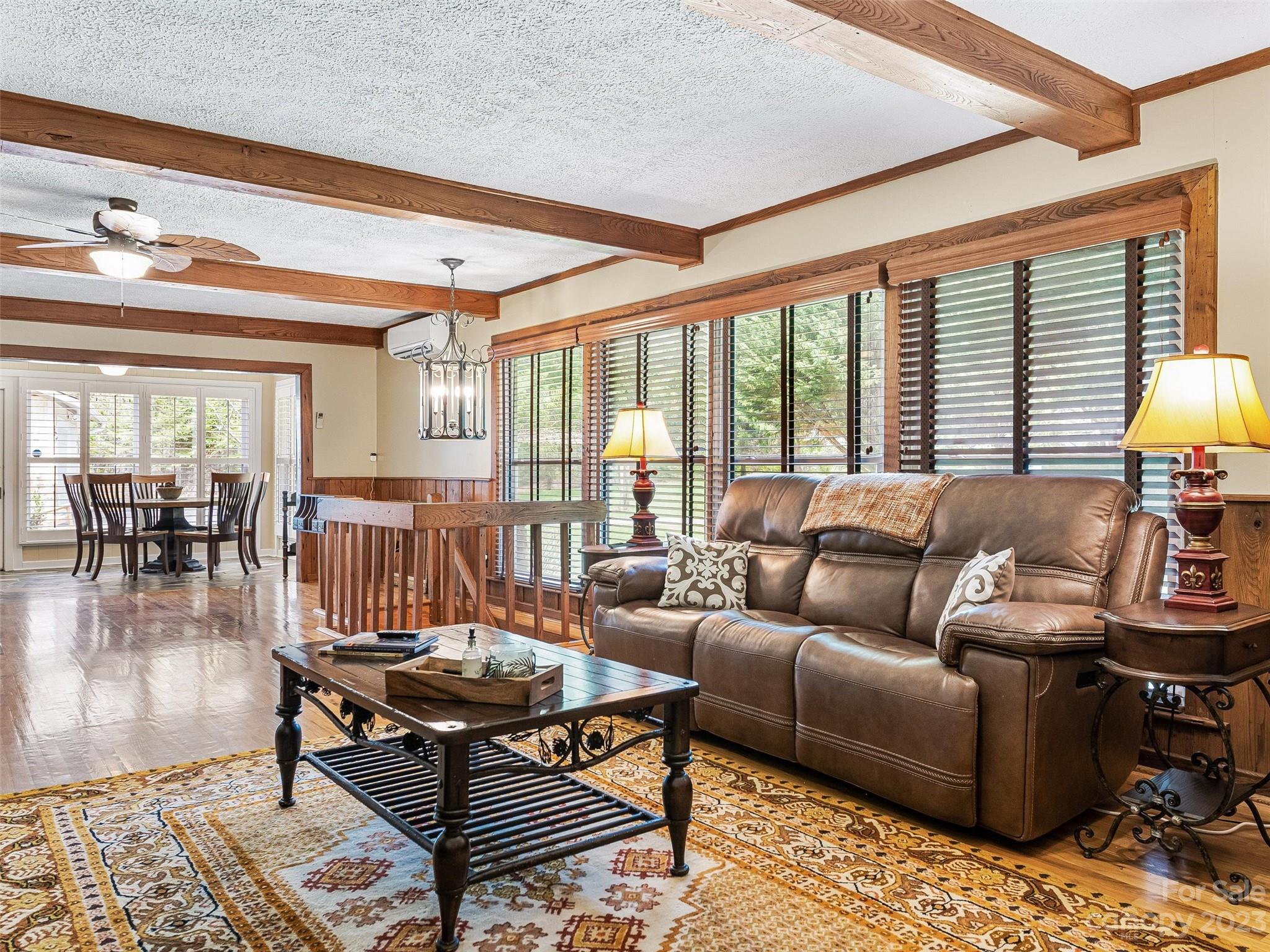 176 Laurel Branch Road Maggie Valley, NC 28751 - Photo 8 of 45 a living room with furniture and a wooden floor