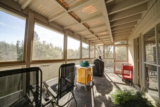 a view of a city from a dining room with large windows