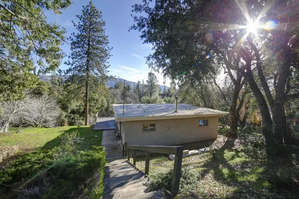 a view of house with backyard