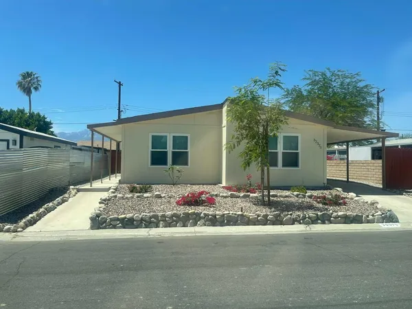 a front view of a house with street