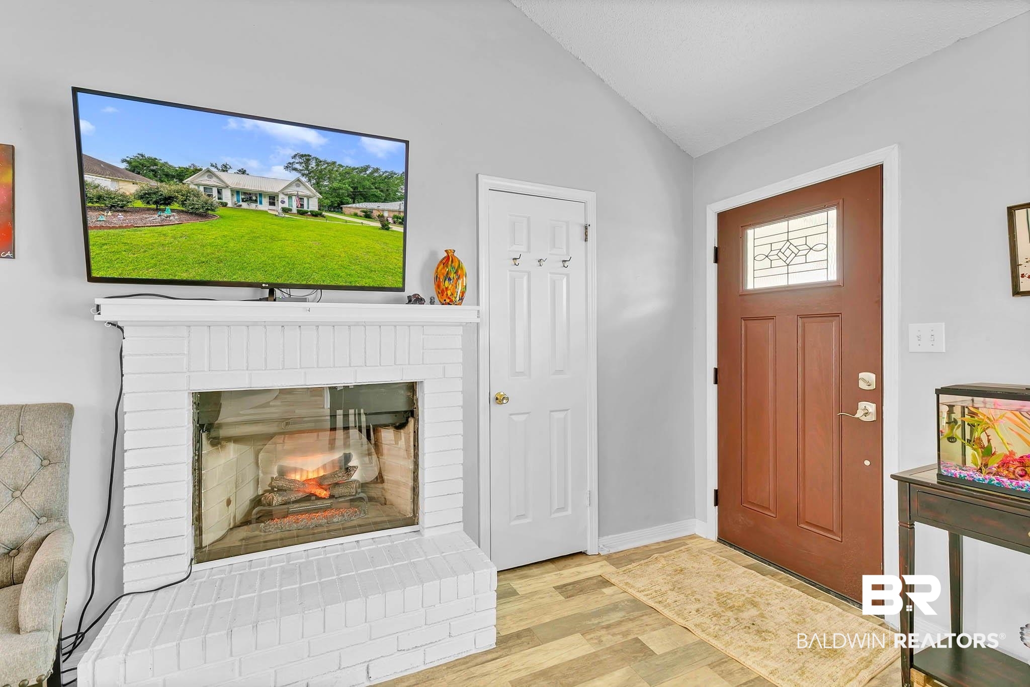 516 Juniper Place Drive Foley, AL 36535 - Photo 3 of 51 Foyer with vaulted ceiling, wood finished floors, and a brick fireplace