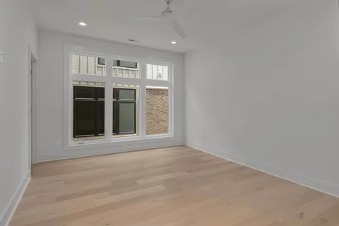 a view of an empty room with a kitchen