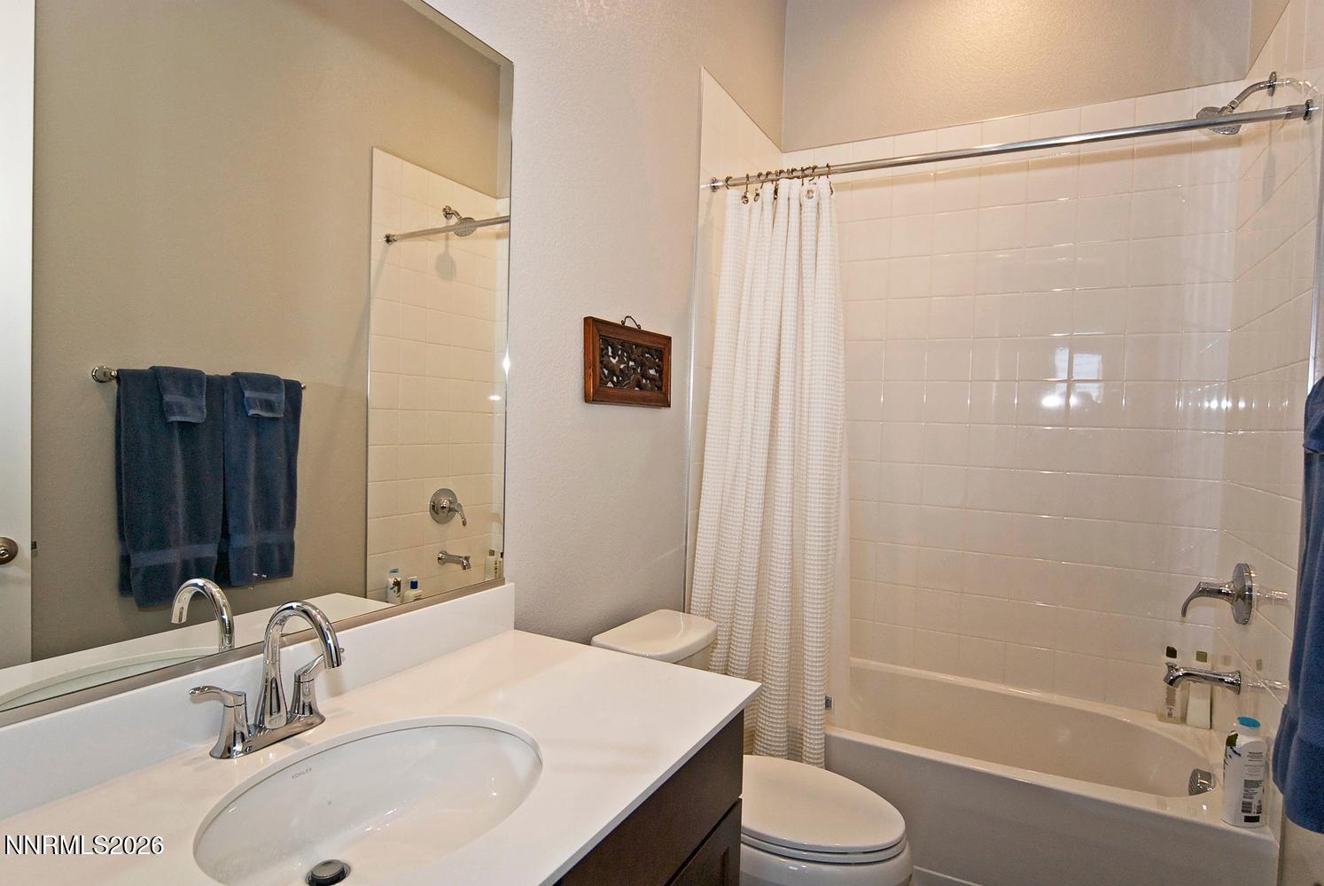 2332 Hammer Falls Drive Reno, NV 89521 - Photo 32 of 57 a bathroom with a sink toilet and shower
