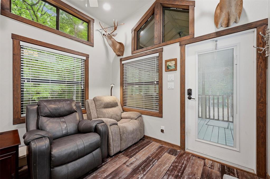 3958 Ranch Road Whitesboro, TX 76273 - Photo 10 of 40 Interior space with contrasting white walls and dark wood-finish trim and window frames