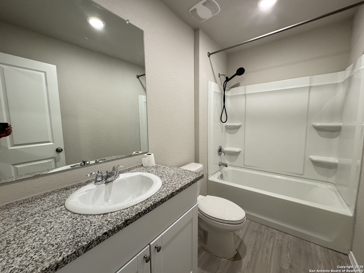 5523 Basil Chase St. Hedwig, TX 78152 - Photo 12 of 15 a bathroom with a granite countertop sink toilet and shower