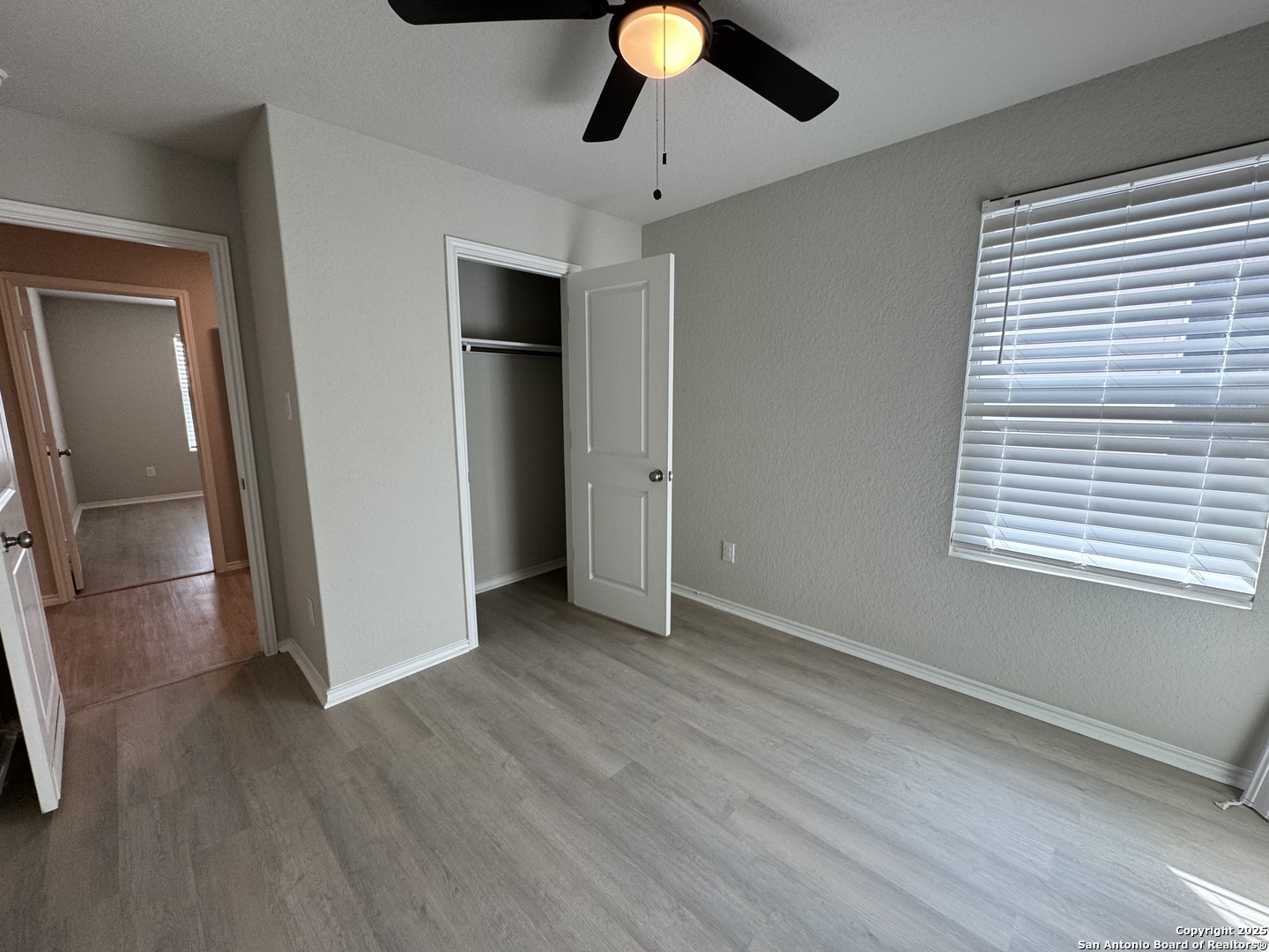 5523 Basil Chase St. Hedwig, TX 78152 - Photo 10 of 15 a view of empty room with wooden floor and fan