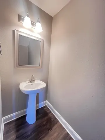 a bathroom with a sink and mirror