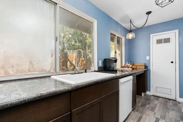 a kitchen with a sink and a window