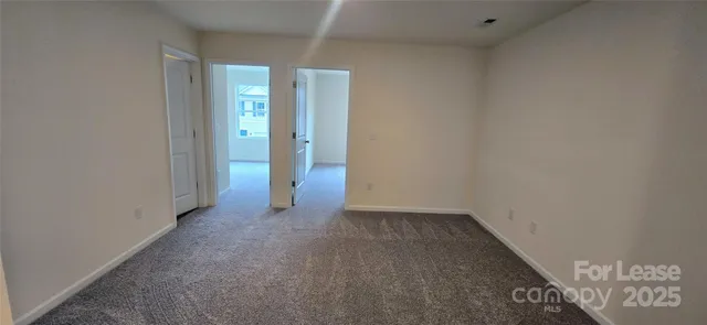 an empty room with entrance door