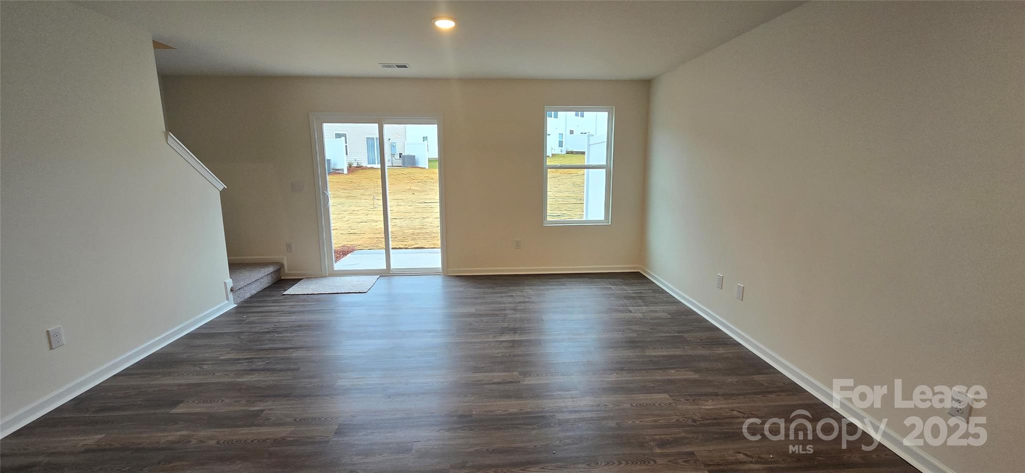1931 B Tranquility Circle Newton, NC 28658 - Photo 5 of 20 an empty room with wooden floor and windows