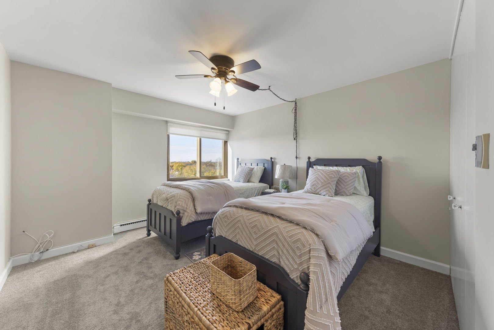 141 North La Grange Road, Unit 803 La Grange, IL 60525 - Photo 14 of 21 a bedroom with a bed and a chandelier