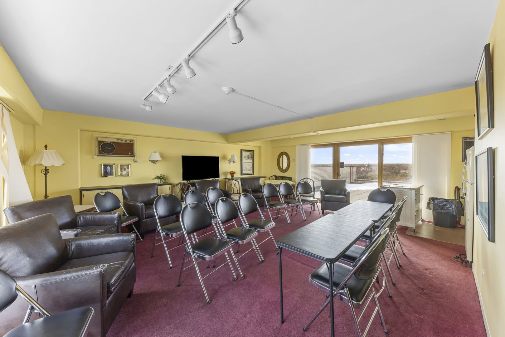 141 North La Grange Road, Unit 803 La Grange, IL 60525 - Photo 18 of 21 a living room with furniture a flat screen tv and a large window