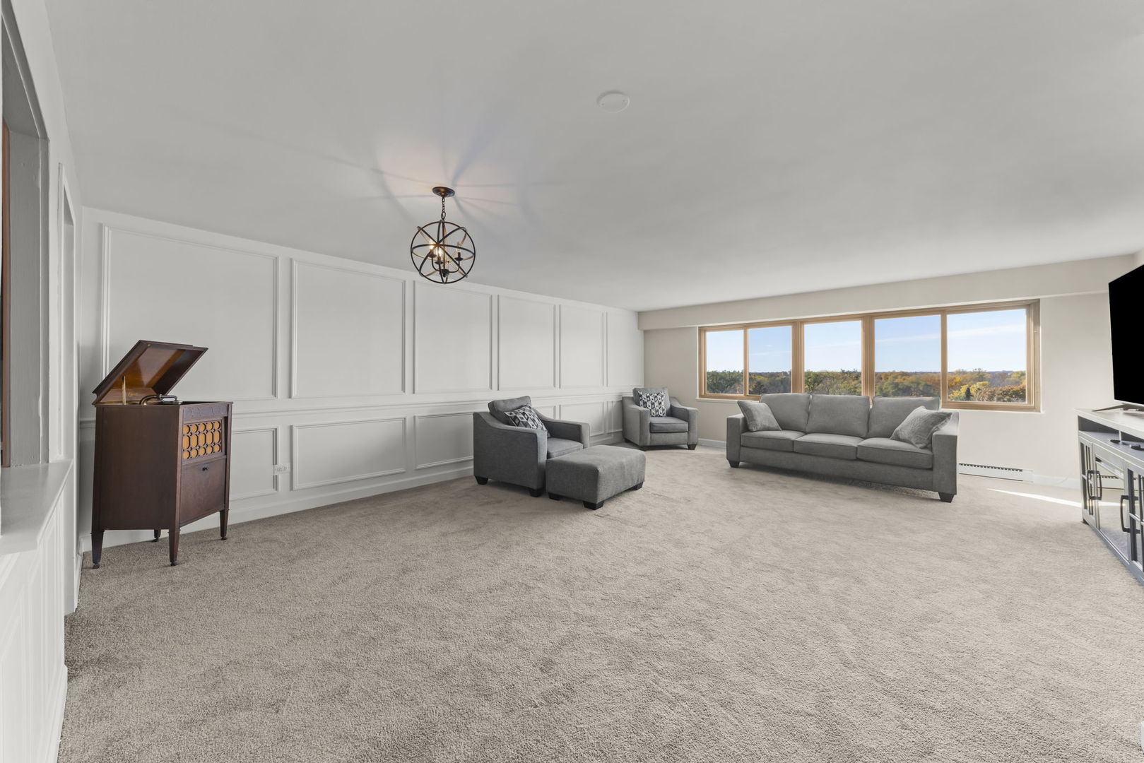 141 North La Grange Road, Unit 803 La Grange, IL 60525 - Photo 3 of 21 a living room with furniture and a chandelier