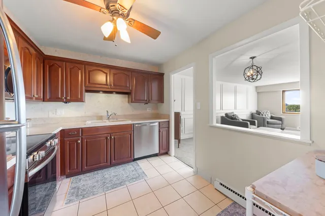 a kitchen with stainless steel appliances granite countertop a sink and cabinets
