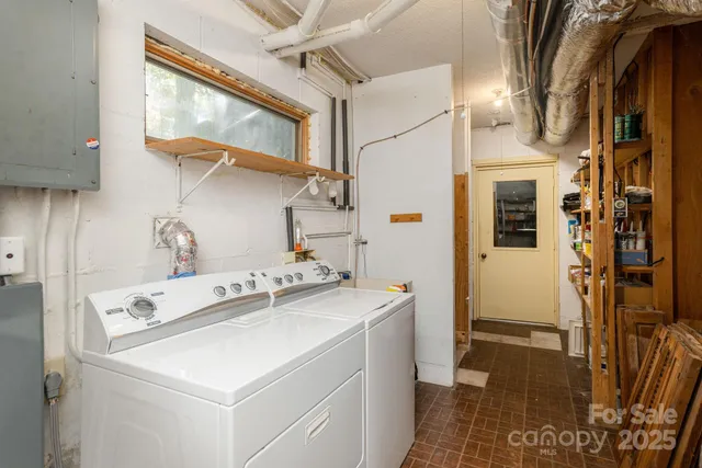 a backyard of a house with a large tree