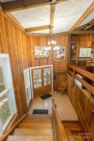 a view of a balcony with furniture and a window