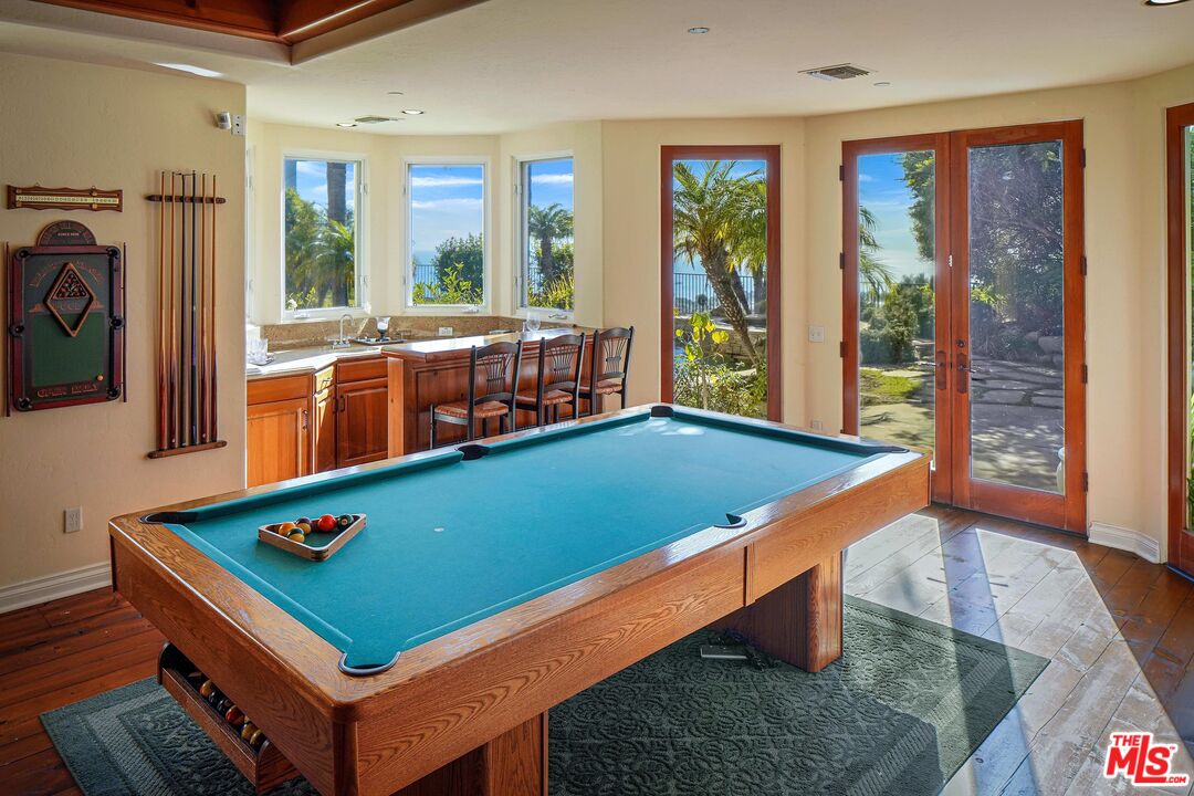 1452 Vía Cresta Pacific Palisades, CA 90272 - Photo 16 of 24 a room with pool table and a large window