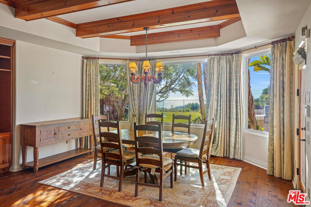 1452 Vía Cresta Pacific Palisades, CA 90272 - Photo 18 of 24 a view of a dining room with furniture window and wooden floor