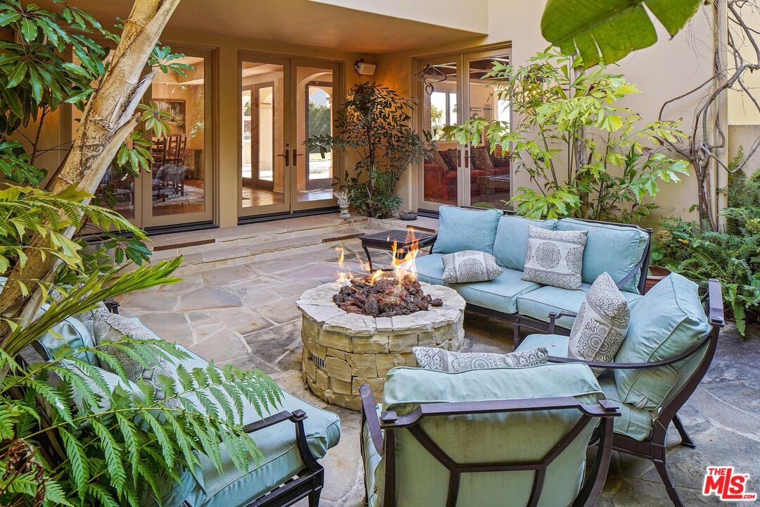 1452 Vía Cresta Pacific Palisades, CA 90272 - Photo 9 of 24 a outdoor living space with furniture and a potted plant