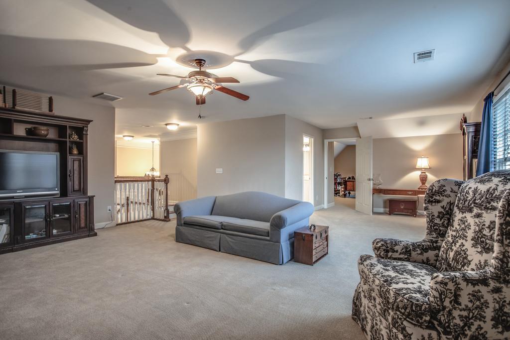 438 Beauchamp Circle Franklin, TN 37067 - Photo 14 of 30 a living room with furniture and a flat screen tv