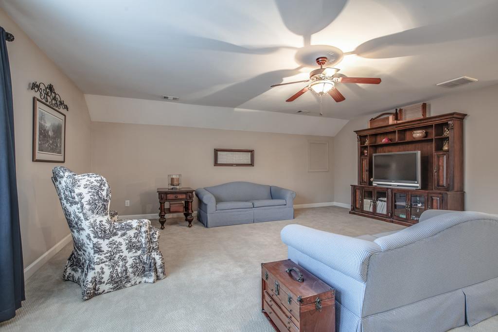 438 Beauchamp Circle Franklin, TN 37067 - Photo 15 of 30 a living room with furniture and a flat screen tv