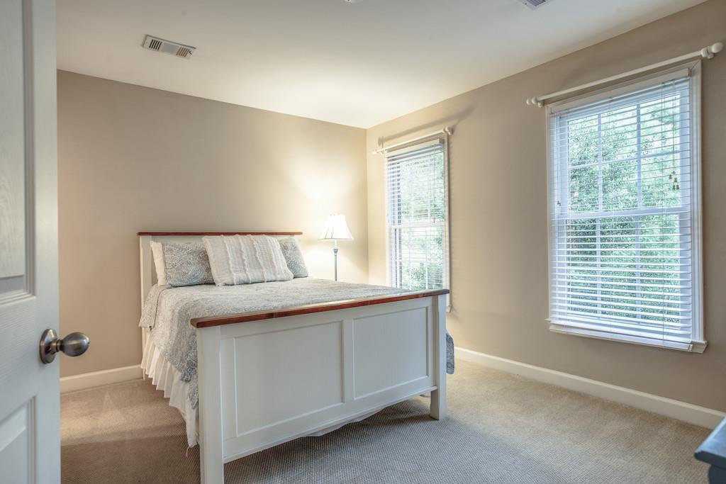 438 Beauchamp Circle Franklin, TN 37067 - Photo 19 of 30 a bedroom with a bed and a window