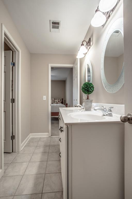 438 Beauchamp Circle Franklin, TN 37067 - Photo 20 of 30 a bathroom with a sink and a mirror