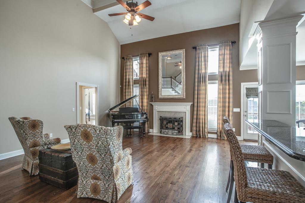 438 Beauchamp Circle Franklin, TN 37067 - Photo 7 of 30 a view of a livingroom with furniture and a fireplace