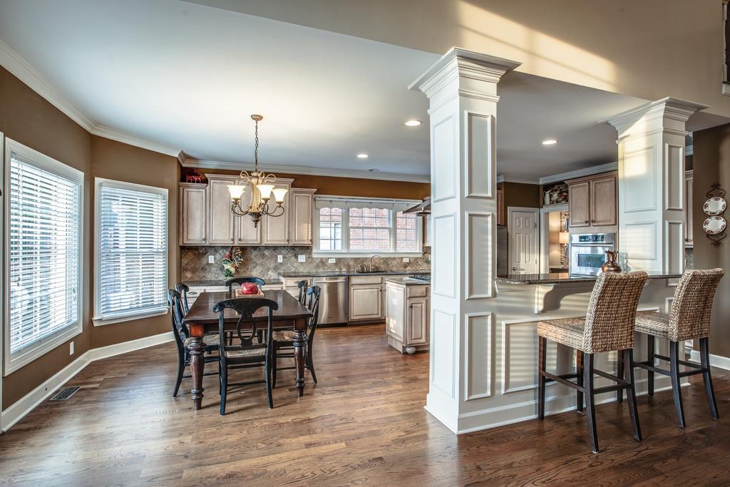438 Beauchamp Circle Franklin, TN 37067 - Photo 8 of 30 a view of a dining room with furniture and chandelier