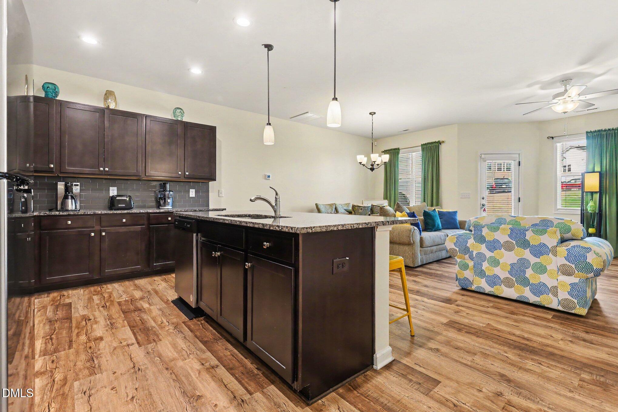 738 Putney Hill Road Zebulon, NC 27597 - Photo 6 of 24 Kitchen and Family Room