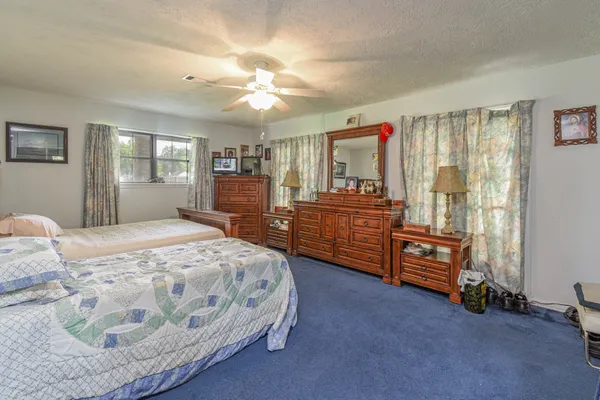 a bedroom with a bed and furniture
