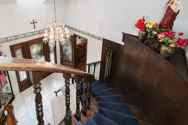 a view of a dining room with furniture and chandelier
