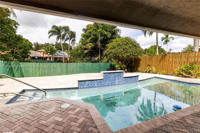 a front view of a house with a yard and porch