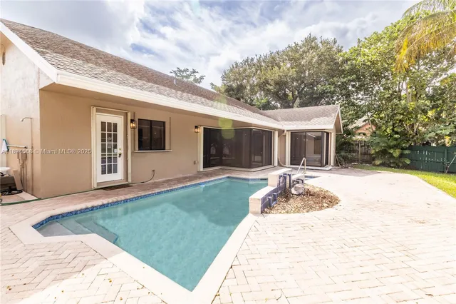a view of a backyard with plants