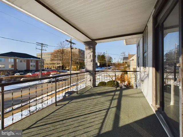 a view of a balcony with chairs