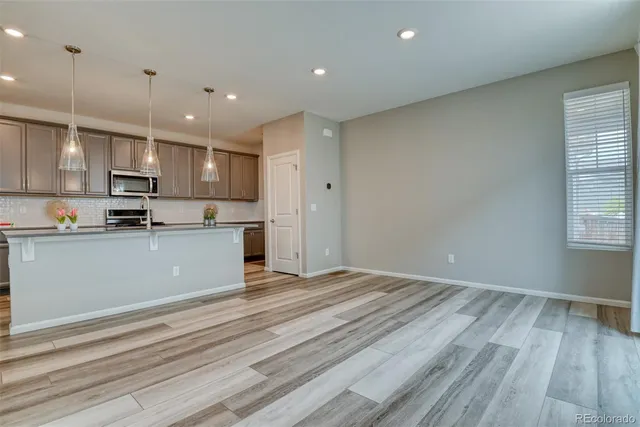 a view of kitchen with wooden floor