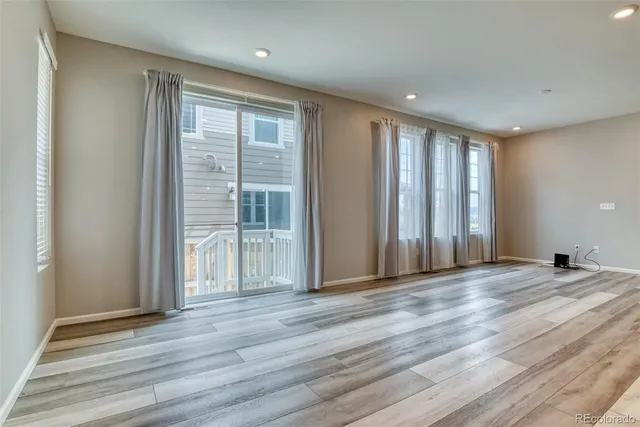 a view of a livingroom with wooden floor