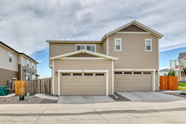 a front view of a house with garage