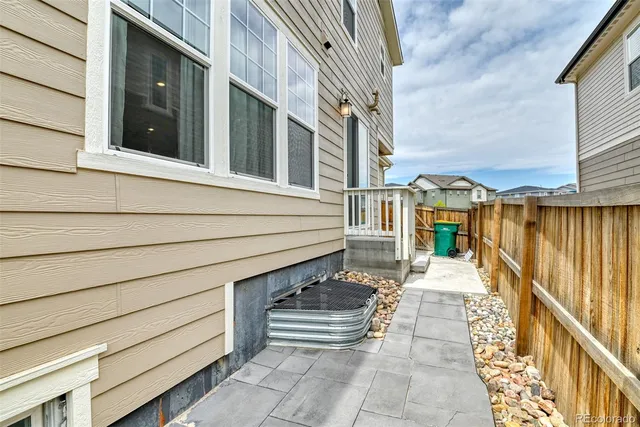 a view of a patio with a table and chairs