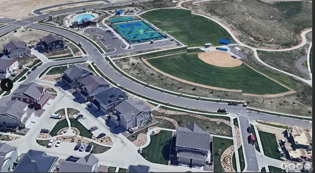 an aerial view of a residential apartment building with a yard