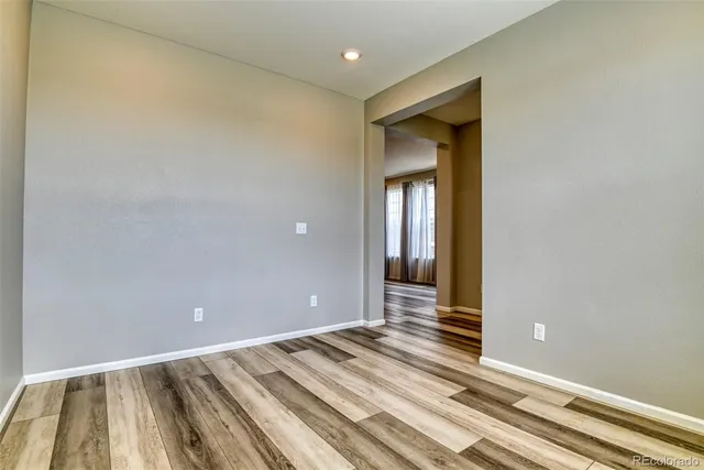 a view of a room with wooden floor and closet