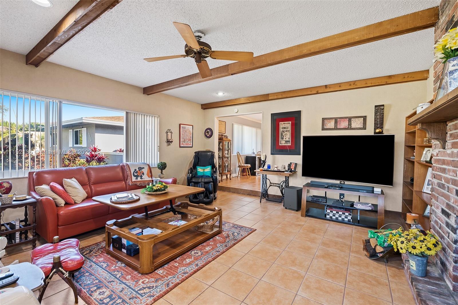 4314 Fillmore Street Hollywood, FL 33021 - Photo 14 of 27 a living room with furniture and a flat screen tv
