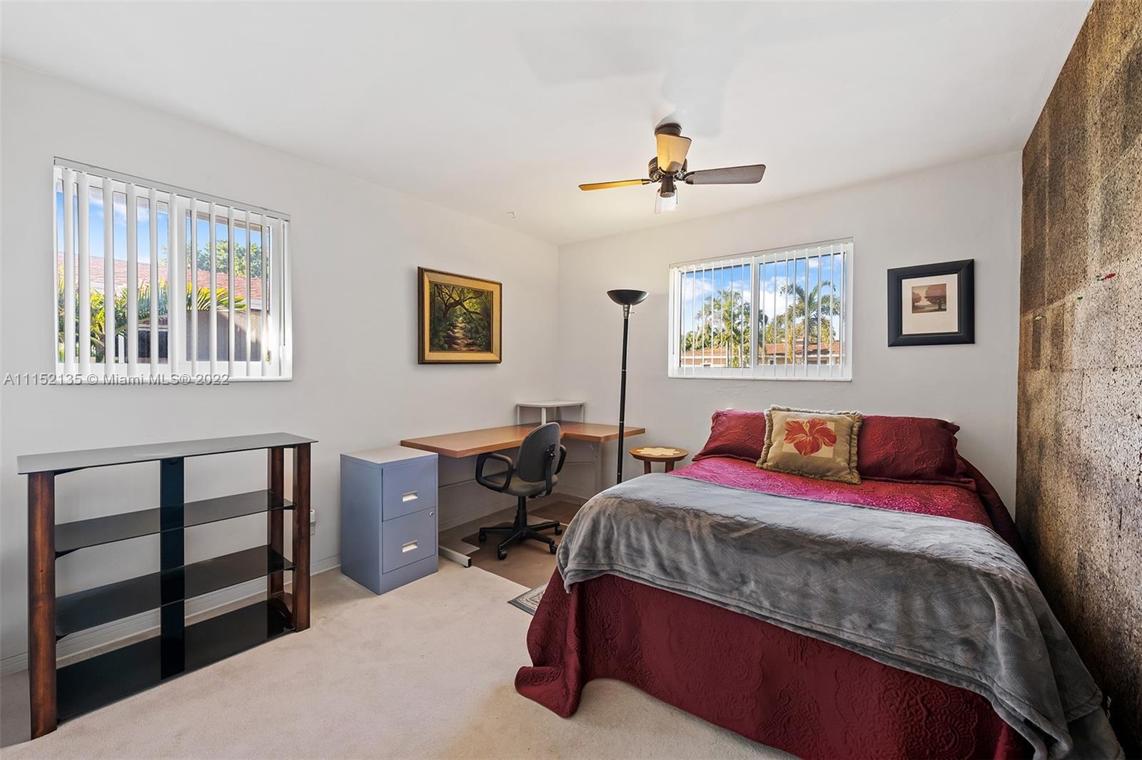 4314 Fillmore Street Hollywood, FL 33021 - Photo 20 of 27 a bedroom with a bed and a dresser